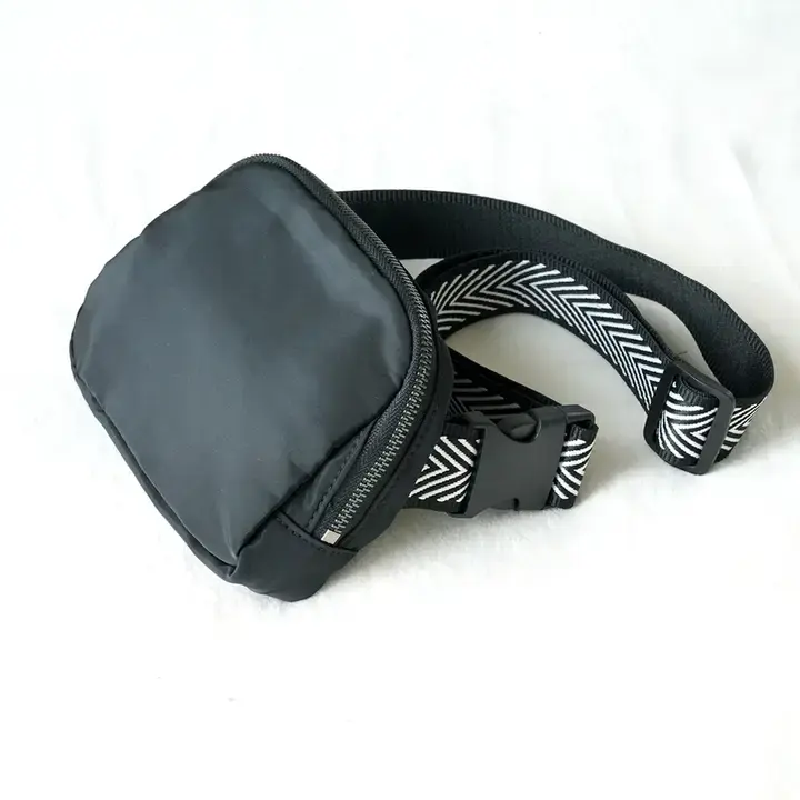 Crossbody belt bag interior and adjustable strap detail