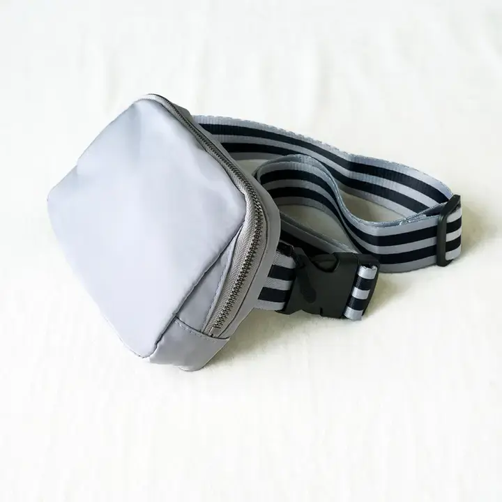 Silver crossbody belt bag with striped adjustable strap