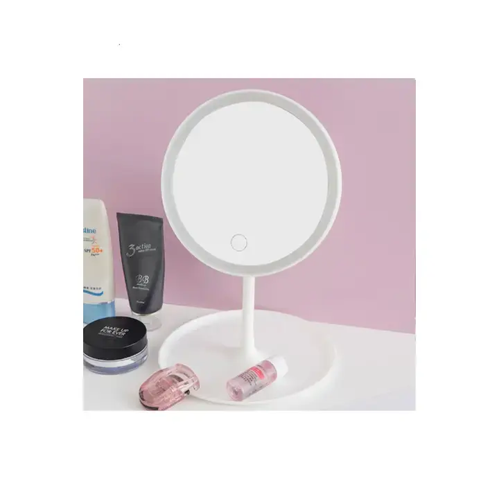 Pink LED vanity mirror styled with beauty products