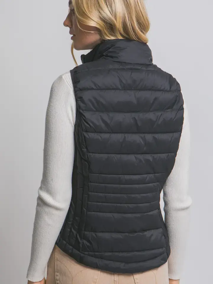 Black packable puffer vest back view